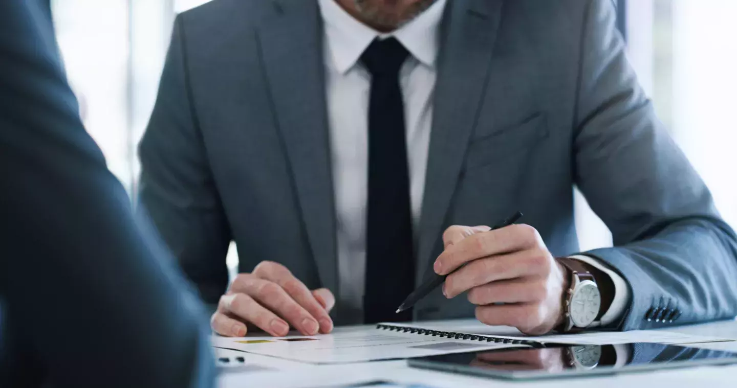 Business Man Reviewing Forms